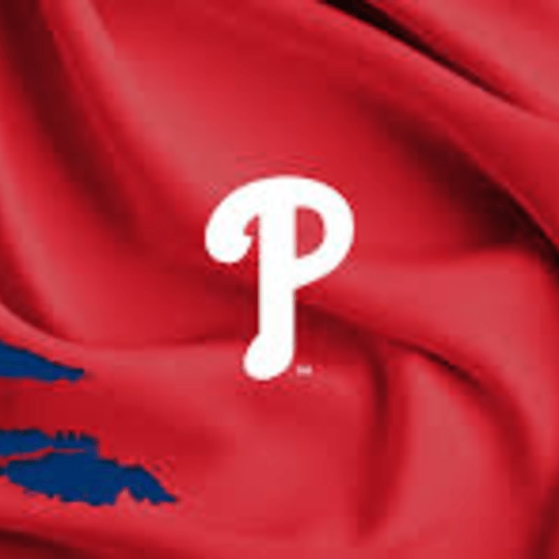 A white stylized letter "P" sits in the center of a draped, red fabric background.