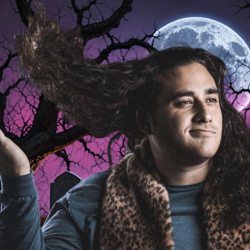 A man with long, flowing hair and a leopard-print vest stands in the foreground against a background of a full moon, a gnarled tree, and a purple sky.