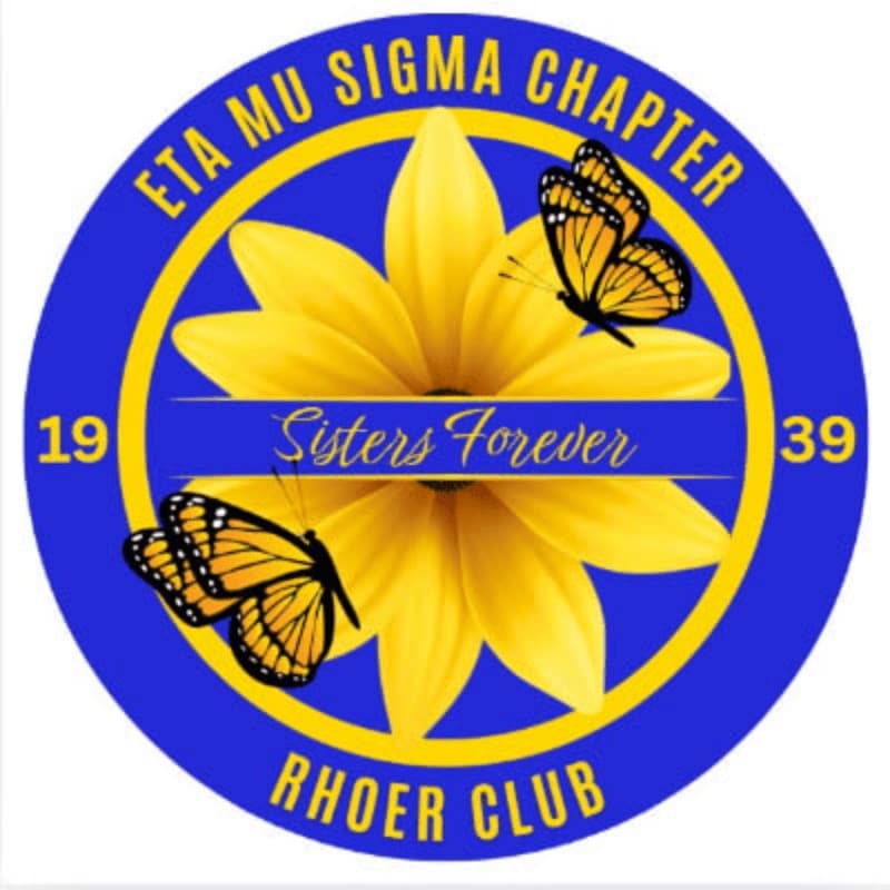 A yellow flower and two orange butterflies are centered within a blue circular border containing the text "ETA MU SIGMA CHAPTER," "RHOER CLUB," "1939," and "Sisters Forever."