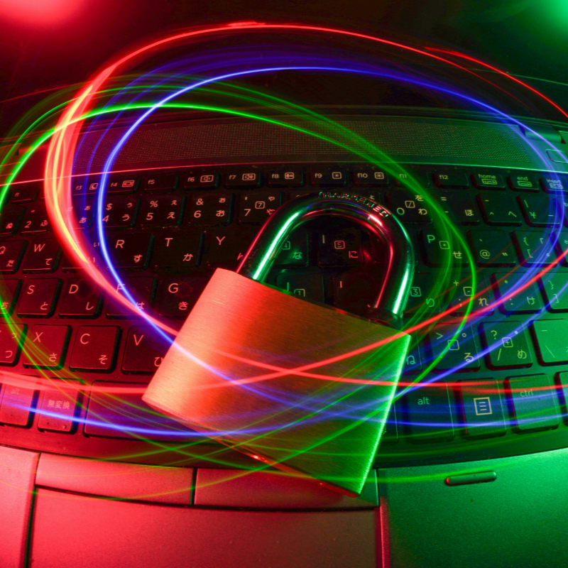padlock on laptop with light trails