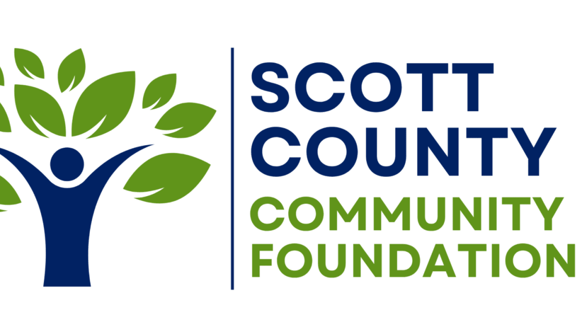 A logo featuring a stylized blue figure forming a tree trunk with green leaves on the left and the text "SCOTT COUNTY COMMUNITY FOUNDATION" on the right, all set against a plain white background.