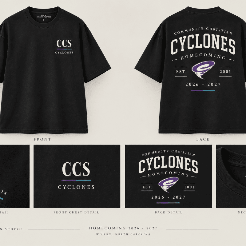 A black t-shirt with "CCS Cyclones" on the front and a large "Community Christian Cyclones Homecoming" graphic on the back is displayed against a light gray background.