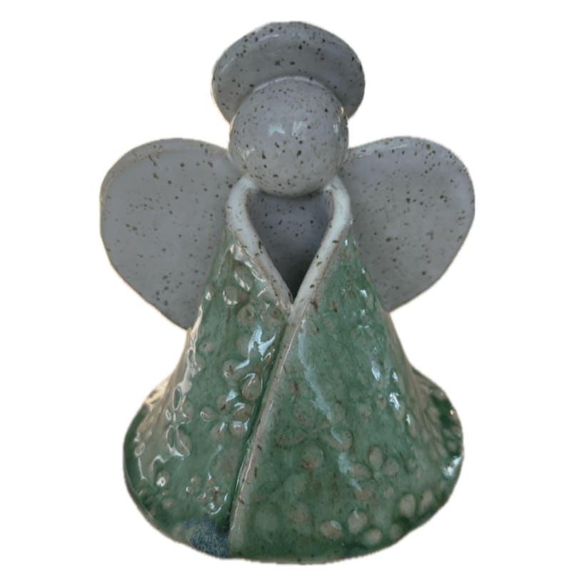 A small ceramic angel figurine with a green textured robe and white wings stands against a plain white background.