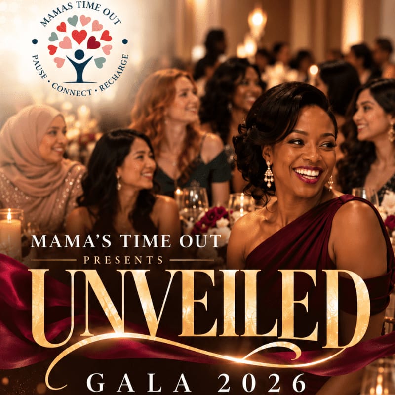 A smiling woman in a maroon dress stands in the foreground of a crowded, warmly lit gala event with other guests chatting in the background.
