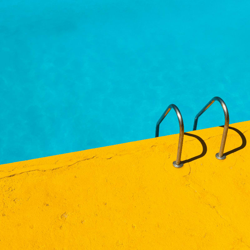 swimming pool with stainless steel ladder