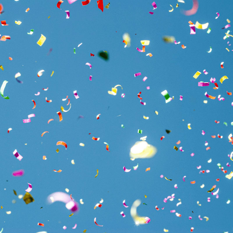 colorful confetti against blue sky