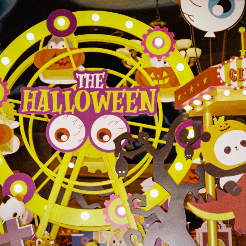 a carnival with a sign that says the halloween fair
