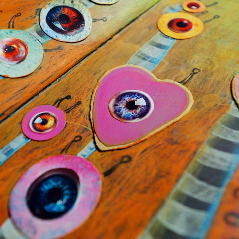 Abstract art with colorful eyes and hearts