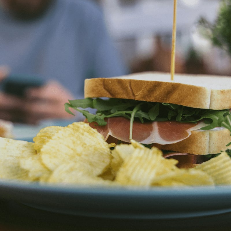 a sandwich with eggs and bacon