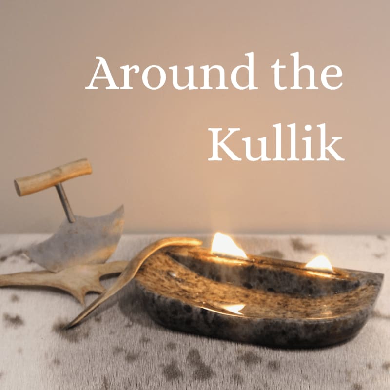 A lit stone kullik lamp and traditional tools sit in the foreground against a plain, neutral background with the text "Around the Kullik."