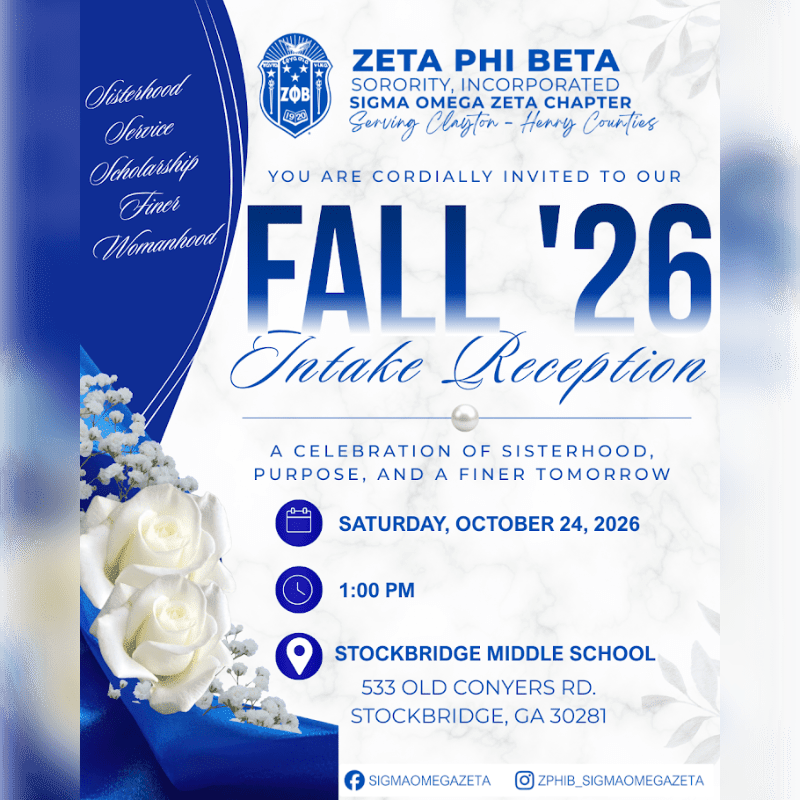 White roses and baby's breath sit in the foreground of an invitation for a Zeta Phi Beta intake reception set against a white marble background.