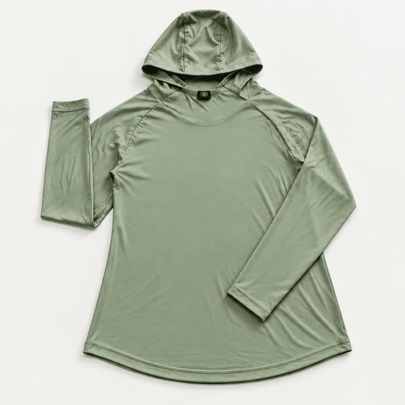 A sage green long-sleeved hooded shirt is laid flat against a plain white background.