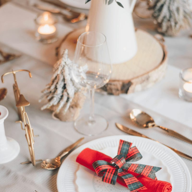 red and white ribbon on gold round tray