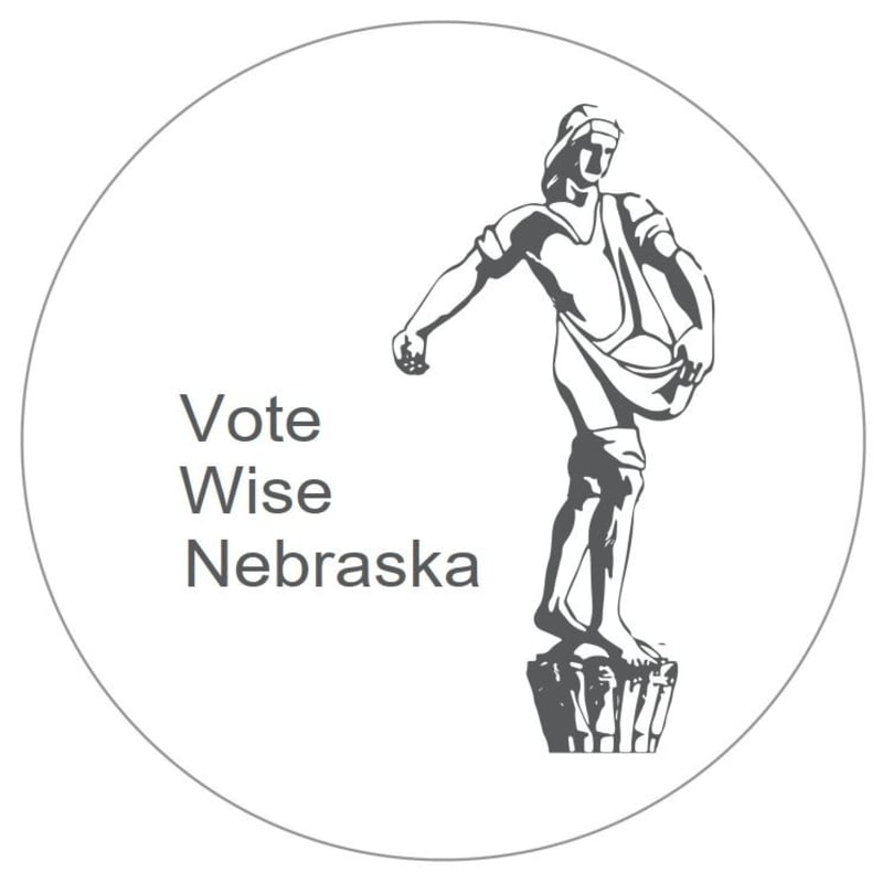 A grey illustration of a classical statue and the text "Vote Wise Nebraska" are centered within a circular border on a white background.