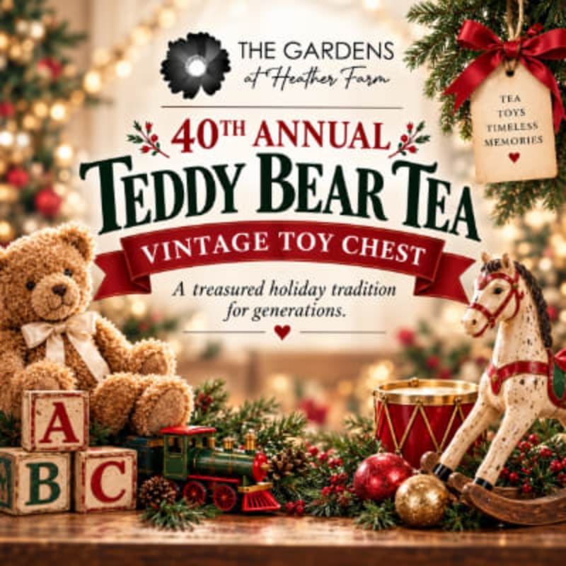 A teddy bear, toy blocks, a train, and a rocking horse sit in the foreground against a blurred background of festive holiday lights and greenery.