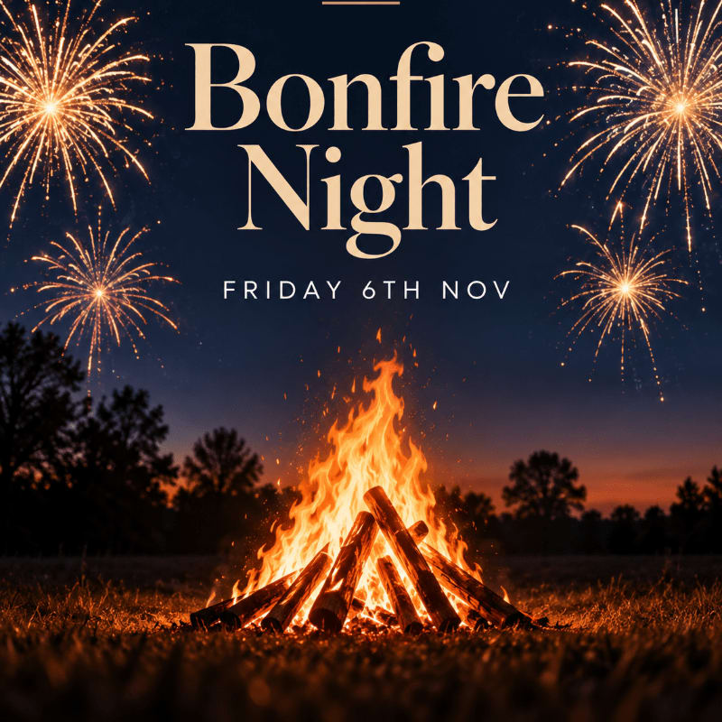 A blazing bonfire glows in a grassy field under a dark night sky filled with fireworks and the text "Bonfire Night Friday 6th Nov."
