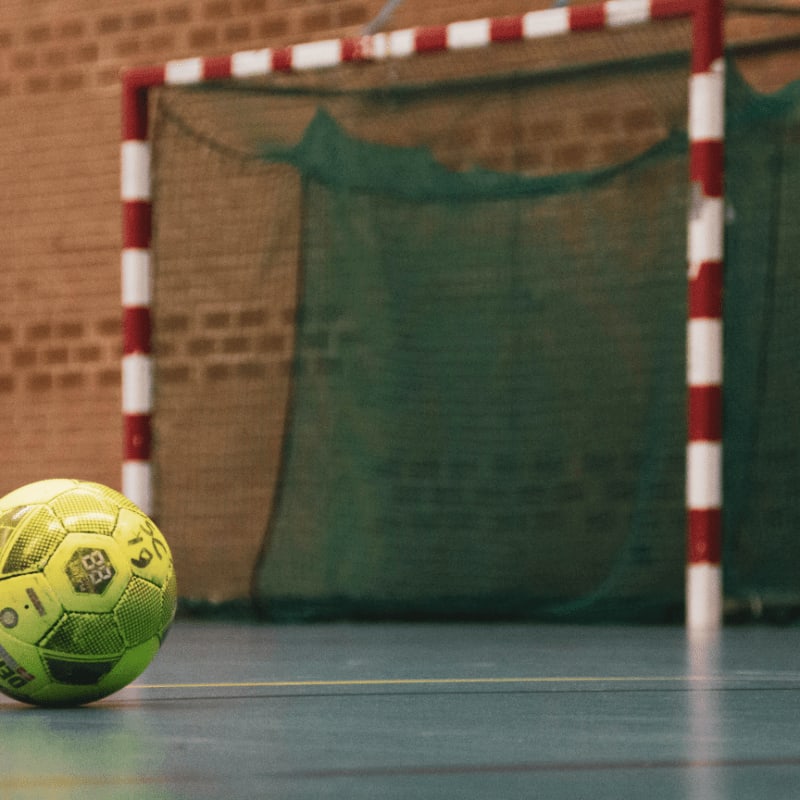 yellow and black soccer ball on field