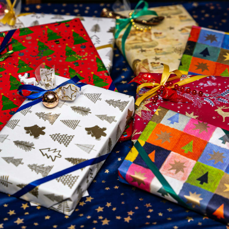 a group of wrapped presents sitting on top of a table