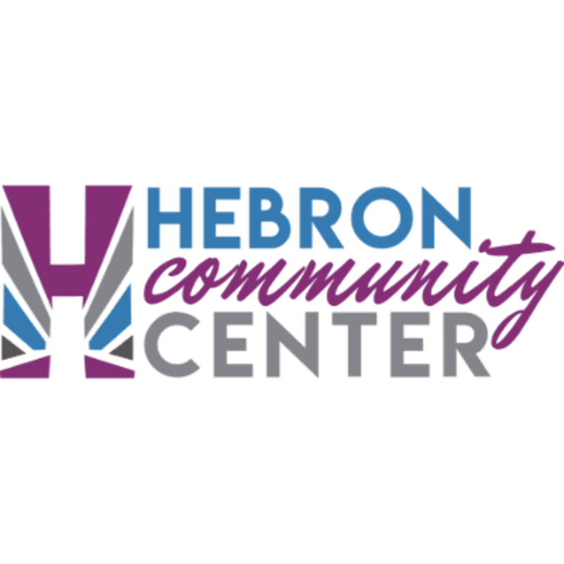 A stylized purple and gray "H" logo stands to the left of the words "HEBRON community CENTER" in blue, purple, and gray text against a white background.