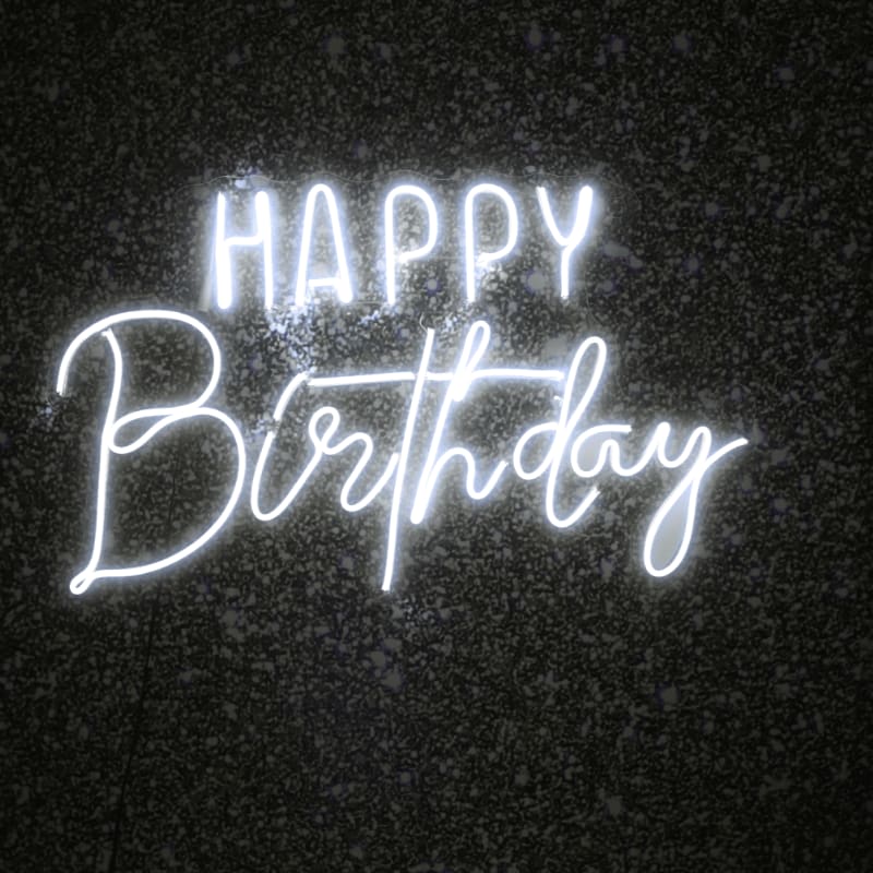 White neon "happy birthday" sign on dark background
