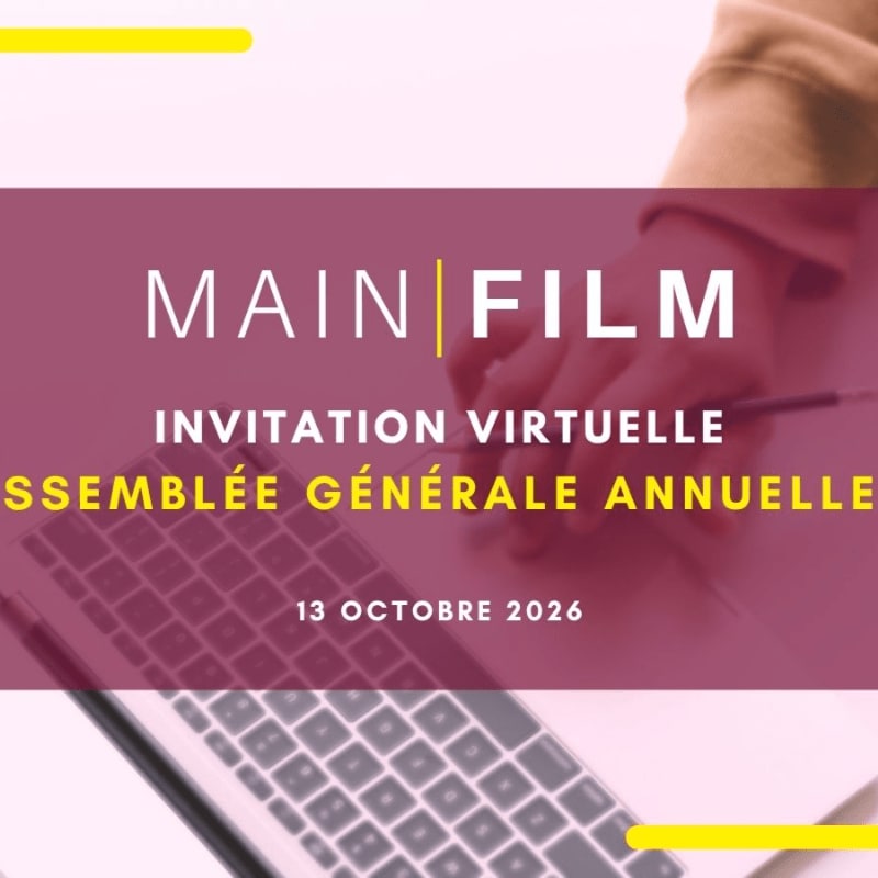 A maroon text overlay with "MAIN FILM" and event details sits in the foreground over a blurred background of a person's hand and a laptop keyboard.