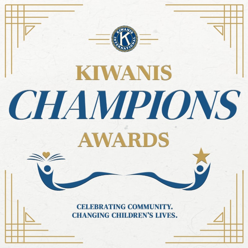 Blue and gold text for the "Kiwanis Champions Awards" is centered on a white textured background framed by gold Art Deco corners.