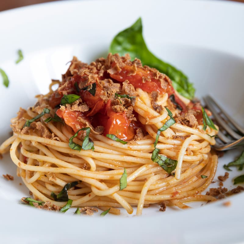 a plate of spaghetti with meat and tomato sauce