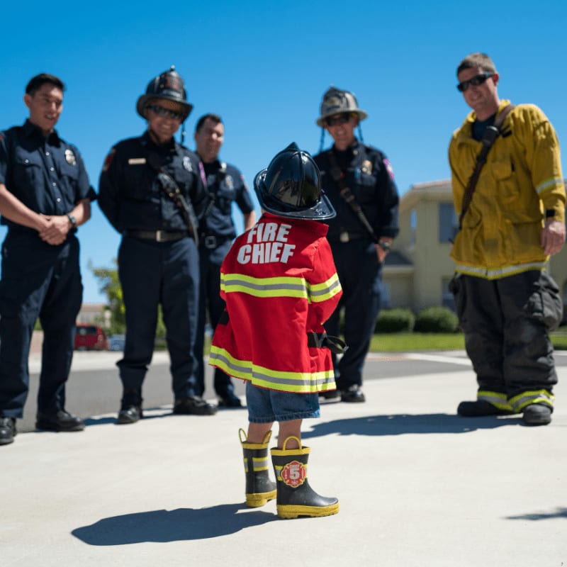 toddler wearing red firefighter uniform