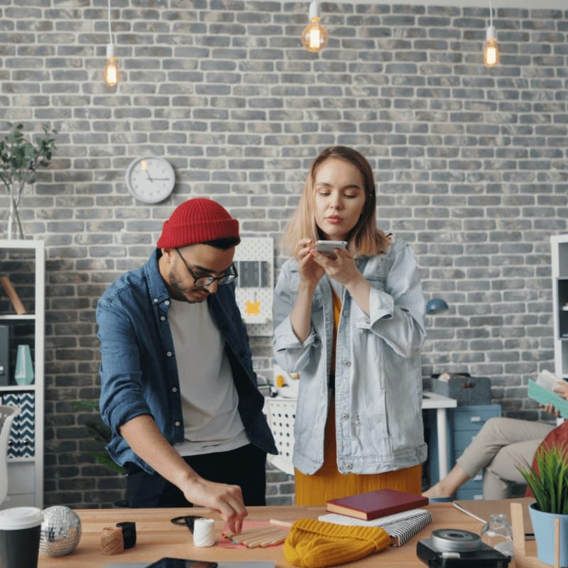 a man and a woman standing in an office