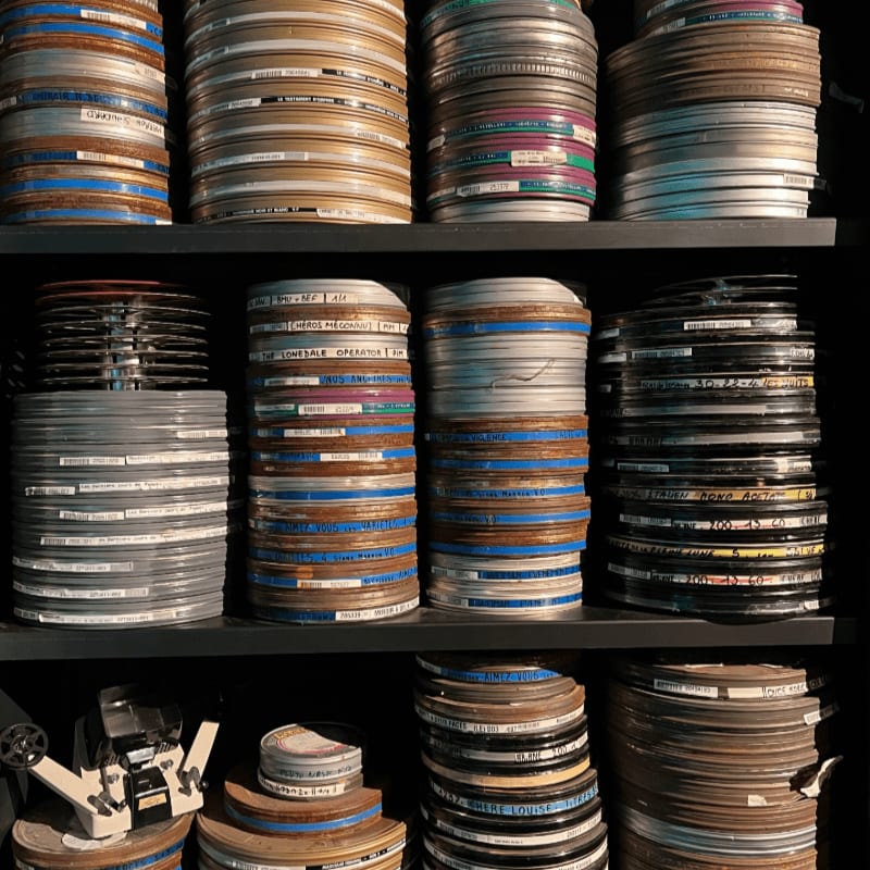 a shelf with many cans of paint