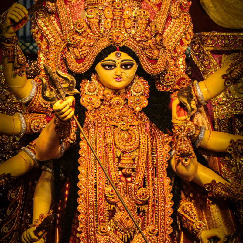 A statue of a hindu god in a temple