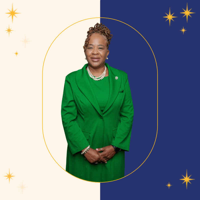 A woman in a green suit stands centered within a gold circle against a split background of cream and navy blue adorned with gold stars.