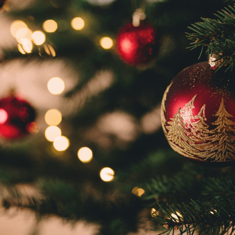 shallow focus photography of red bauble on christmas tree