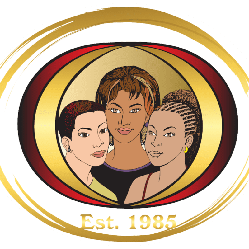 Three women of color are centered within a red and gold oval frame, set against a white background with a gold circular border and the text "Est. 1985" at the bottom.