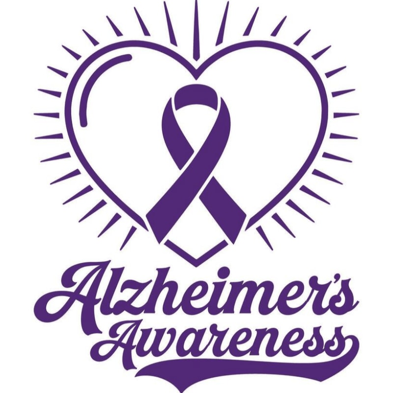 A purple awareness ribbon is centered inside a radiating heart outline above the text "Alzheimer's Awareness" against a plain white background.