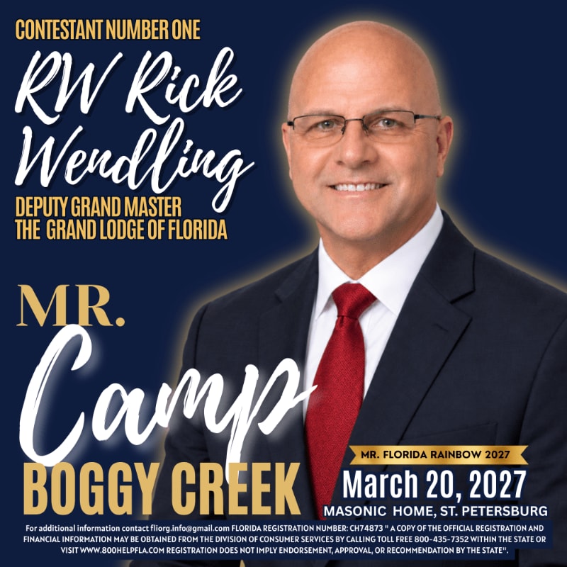 A smiling man in a suit and red tie stands in the foreground against a dark blue background featuring white and gold promotional text.