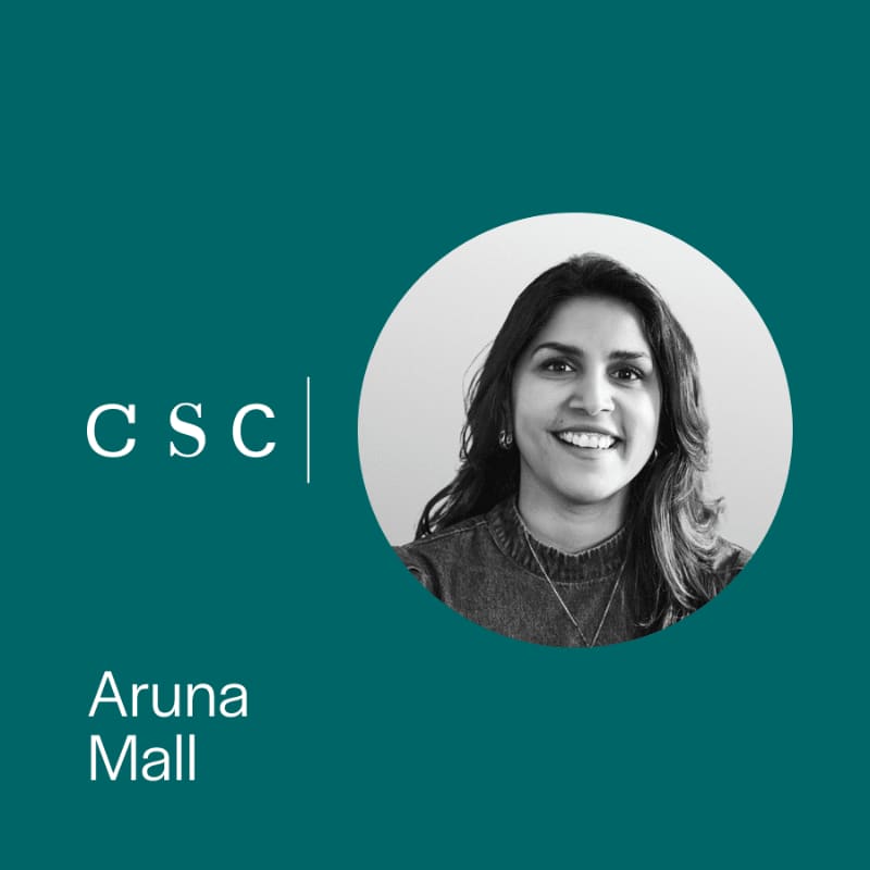 A black and white circular portrait of Aruna Mall and the "CSC" logo are set against a solid teal background.