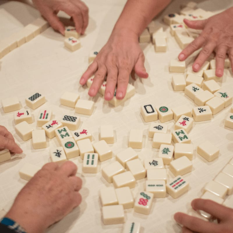 person playing white and brown lego blocks