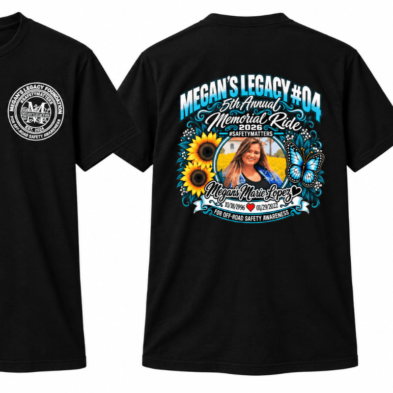 A black t-shirt features a colorful memorial graphic on the back and a small circular logo on the front chest.