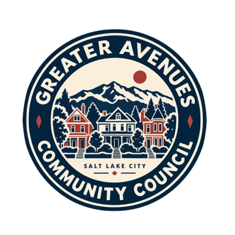 A circular logo featuring red and white houses and green trees in the foreground against a backdrop of snowy mountains and a red sun.