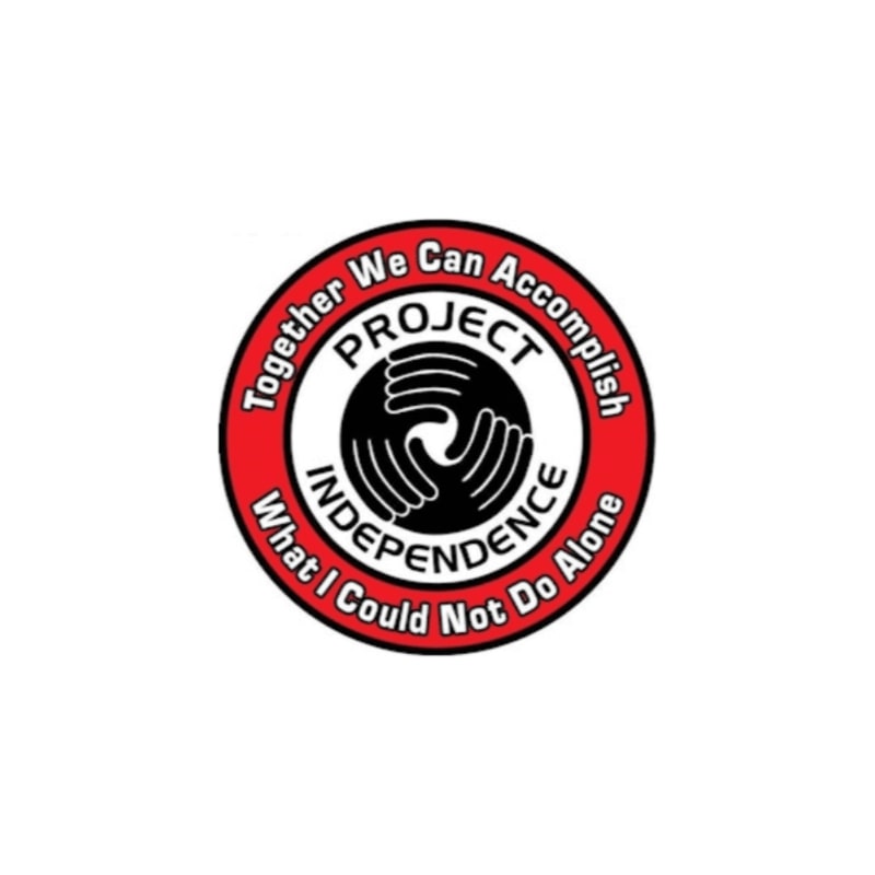 A circular logo featuring a black and white graphic of interlocking hands surrounded by text on a red border, set against a plain white background.