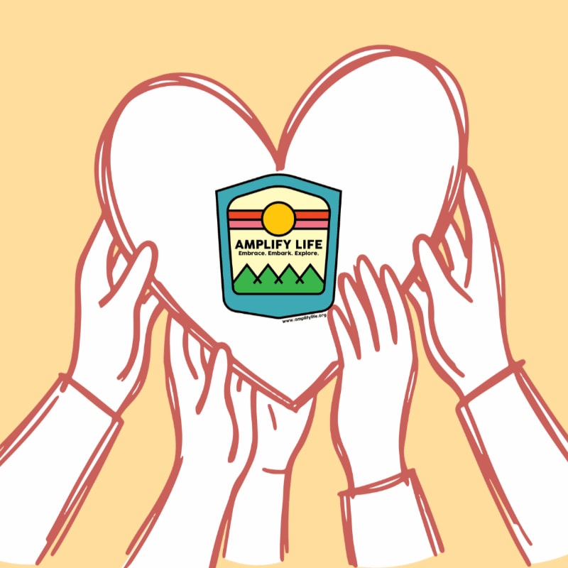 Several hands hold up a large white heart containing an "Amplify Life" logo against a solid light orange background.