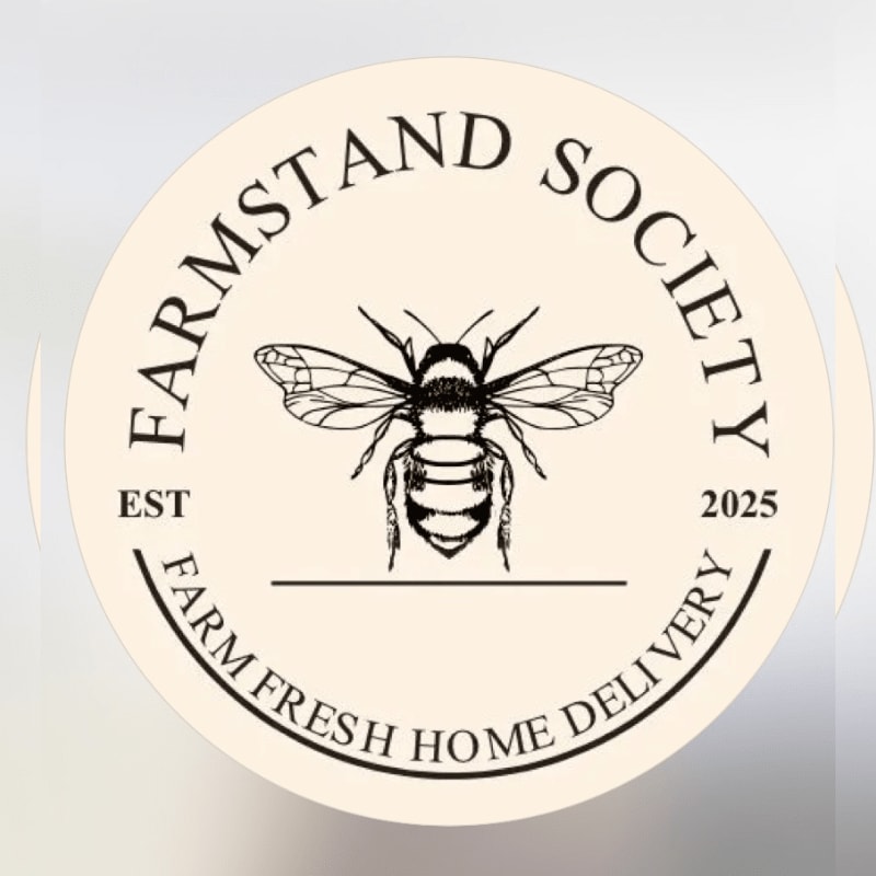 A circular cream-colored logo featuring a detailed black bee illustration and the text "FARMSTAND SOCIETY" and "FARM FRESH HOME DELIVERY" against a plain light gray background.