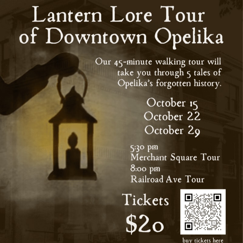 A silhouette of a hand holding a glowing lantern is positioned in the foreground against a dark, textured background featuring event details for the Lantern Lore Tour of Downtown Opelika.