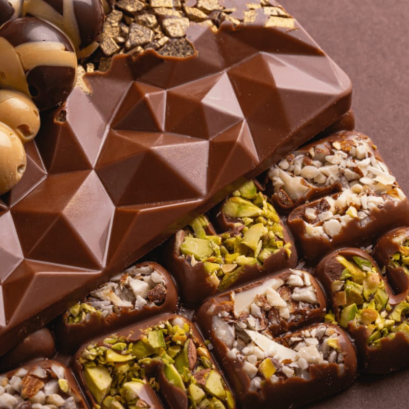 a variety of chocolates and nuts on a table