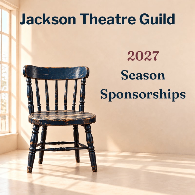 A weathered blue wooden chair sits in the foreground against a plain beige wall with text and a window in the background.