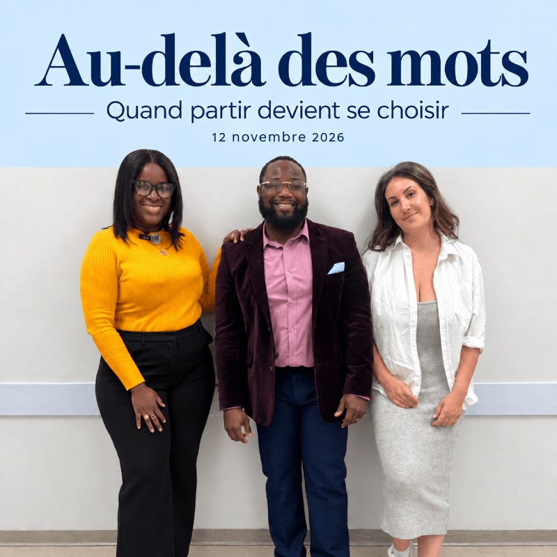 Three people stand smiling in the foreground against a white wall background featuring French text.