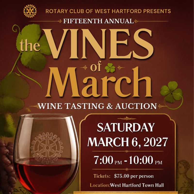 A glass of red wine sits in the foreground against a brown background featuring event text and green shamrocks.