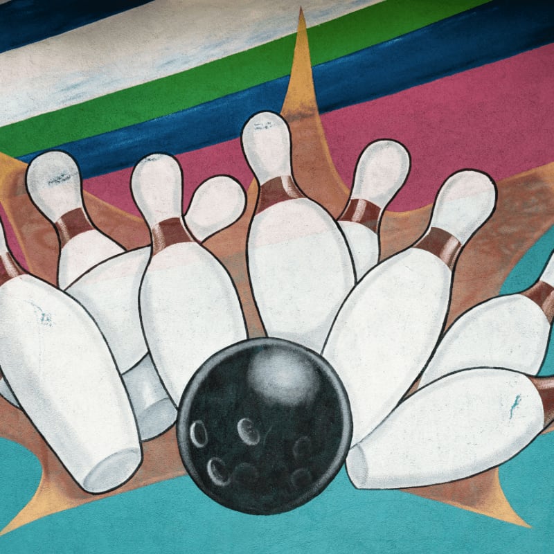 bowling ball crashing to bowling pins artwork