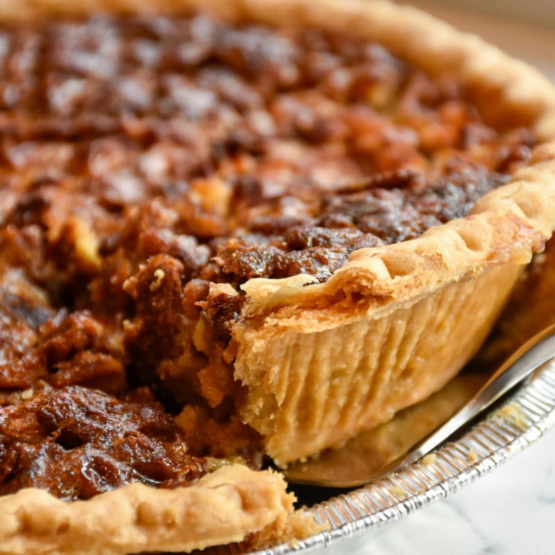 brown pie on white ceramic plate